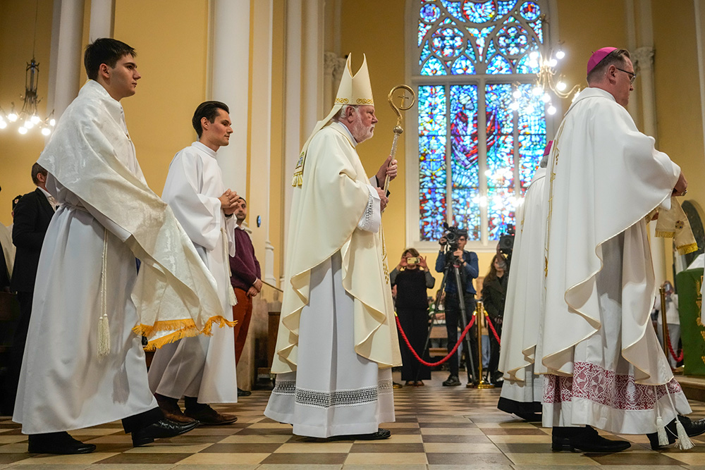 Archbishop Paul Richard Gallagher, center, the Holy See's secretary for relations with states, celebrates a Mass at the Cathedral of the Immaculate Conception in Moscow Aug. 27, 2026. (AP/Pavel Bednyakov)