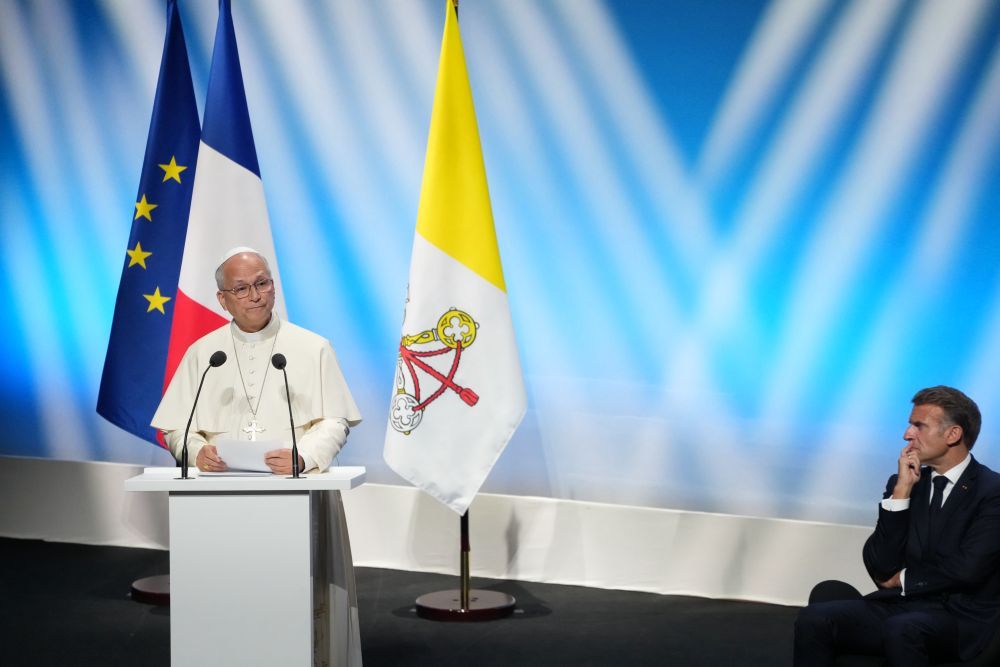 French President Emmanuel Macron, right, listens to Pope Leo XIV delivering his speech at the meeting At the Roots of Europe for Peace and Unity, Monday, Sept. 28, 2026, in Metz, France. (AP/Gregorio Borgia)