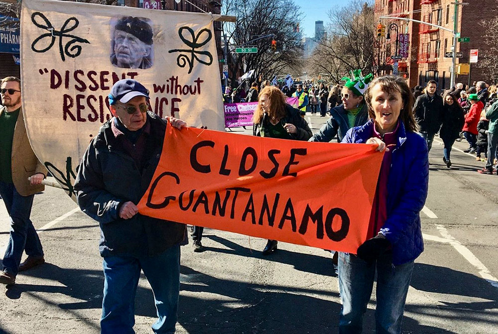 Colleen Kelly, right, marches with a banner calling for the closure of the U.S. military prison at Guantánamo Bay, Cuba, during a St. Patrick's Day parade in 2020. (CNS/Courtesy of Colleen Kelly, September 11th Families for Peaceful Tomorrows)