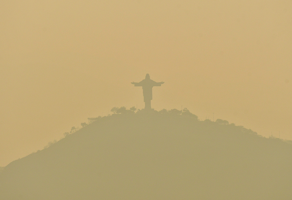 A statue of Christ of Peace atop San Pedro Hill is seen Sept. 10, 2024, shrouded in smoke caused by wildfires in Cochabamba, Bolivia. The Bolivian Bishops' Conference said in a statement the country was suffering from "an ecological disaster caused by human hands." (OSV News/Reuters/Patricia Pinto)