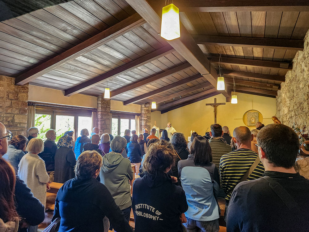 People attend midday Mass at Eremo delle Carceri on the feast of St. Francis, on Oct. 4, 2025. (NCR photo/Brian Roewe)