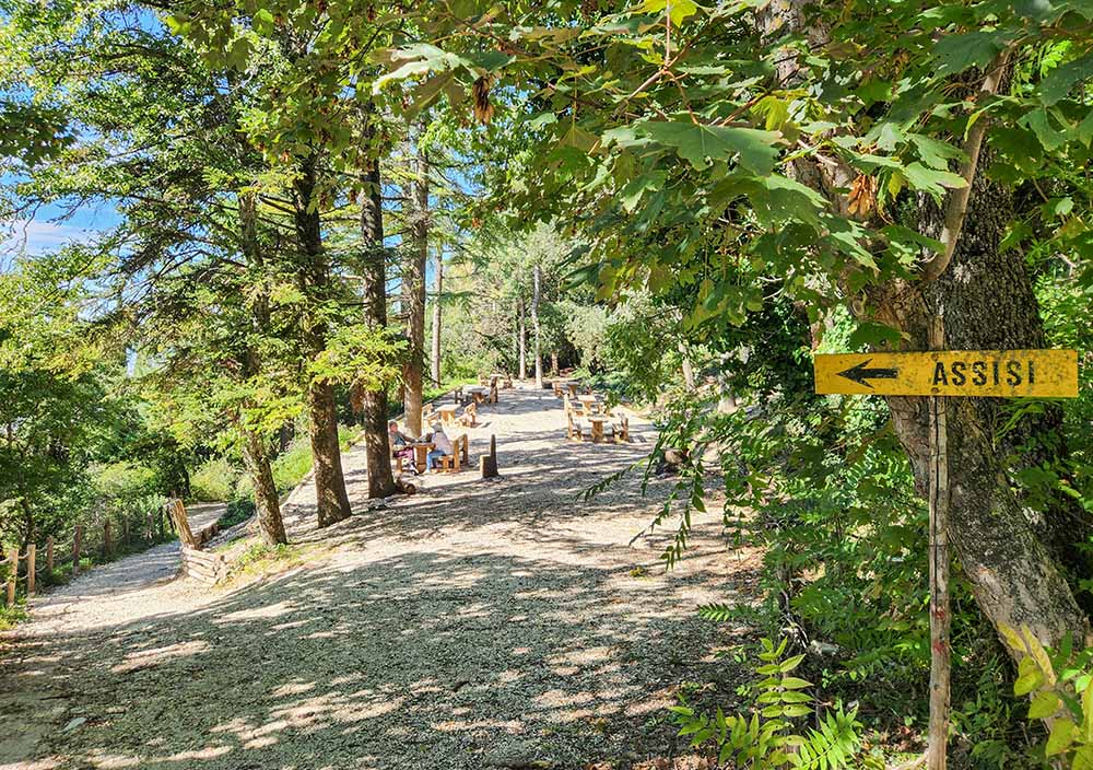 A sign points the way to Assisi along the hiking trail on Mount Subasio in Italy. (NCR photo/Brian Roewe)