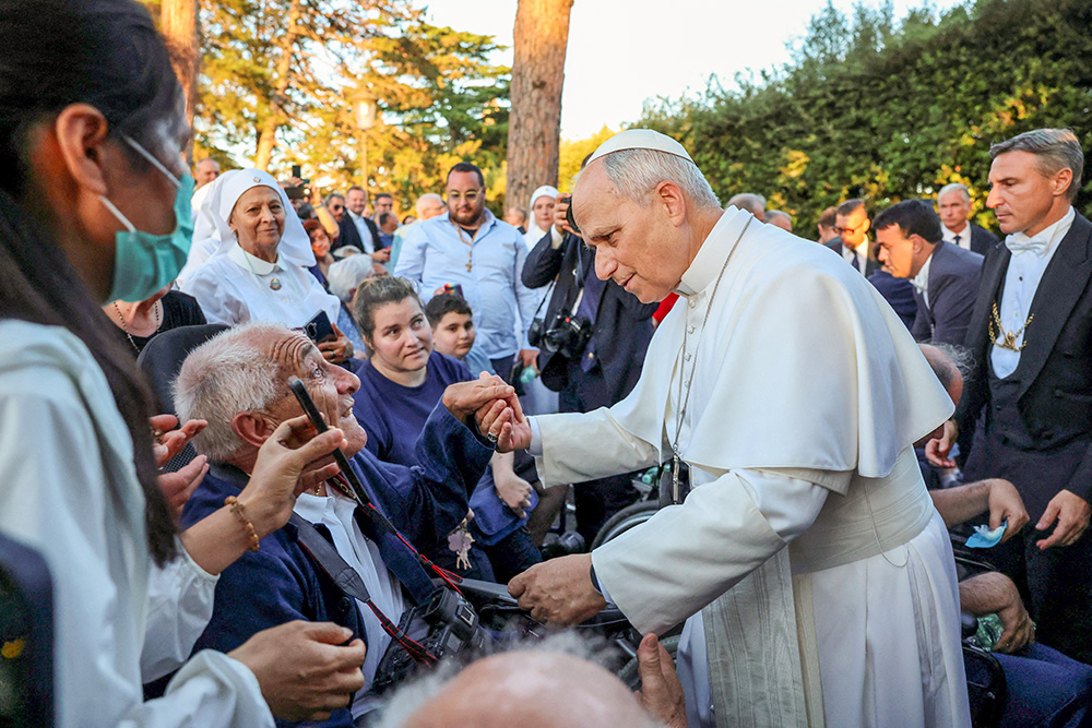 Pope Leo XIV greets the faithful after leading a worldwide rosary for peace at the Grotto of Our Lady of Lourdes in the Vatican Gardens May 30, 2026. (OSV News/Reuters/Yara Nardi)