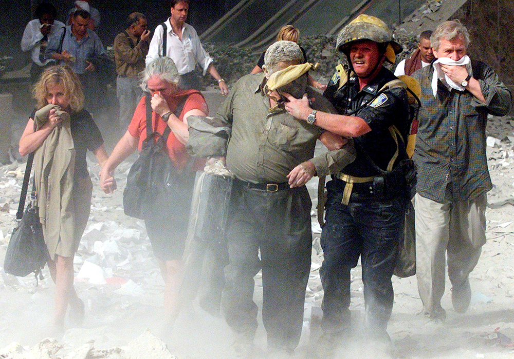People walk away from the World Trade Center in New York City Sept. 11, 2001. (OSV News photo/Reuters/Shannon Stapleton)