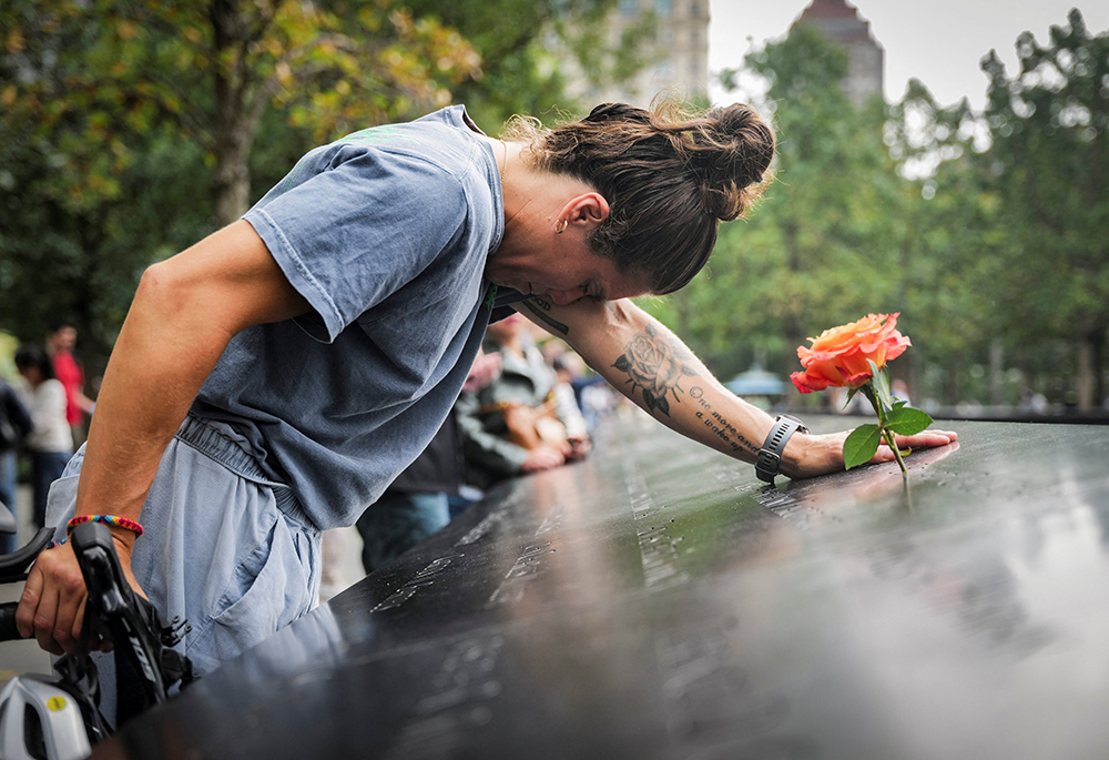Elizabeth Adams reacts at the 9/11 Memorial & Museum reflecting pool in the Manhattan borough of New York City, Sept. 10, 2025, ahead of the 24th anniversary of the Sept. 11, 2001, attacks on the World Trade Center. (OSV News/Reuters/Jeenah Moon)
