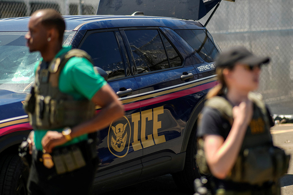 U.S. Immigration and Customs Enforcement agents stand guard, as ICE and federal agents secure the entrance to the Delaney Hall detention center while demonstrators gathered outside in Newark, New Jersey, May 29, 2026. (OSV News/Reuters/Eduardo Munoz)