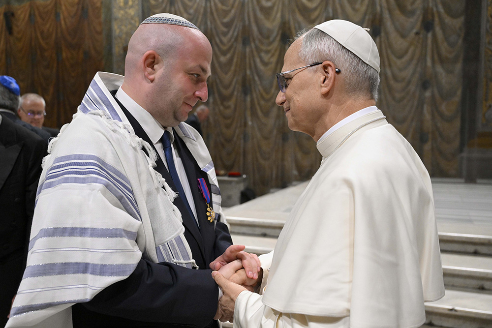 Pope Leo XIV greets Silviu Vexler, president of the Federation of Jewish Communities in Romania, during a ceremony honoring Blessed Iuliu Hossu in the Sistine Chapel at the Vatican June 2, 2025. (CNS/Vatican Media)