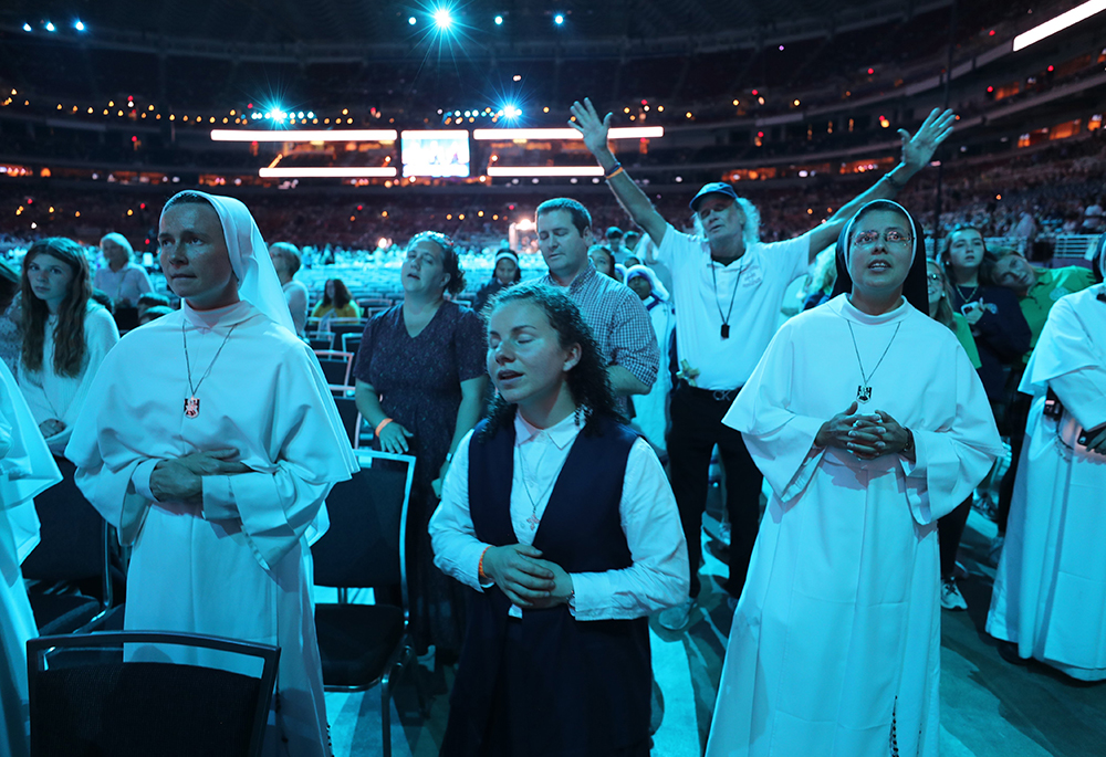 Pilgrims pray while listening to Catholic musician Matt Maher perform ahead of the beatification Mass for Venerable Fulton J. Sheen Sept. 24, 2026, at The Dome at America's Center in St. Louis. (OSV News/Bob Roller)