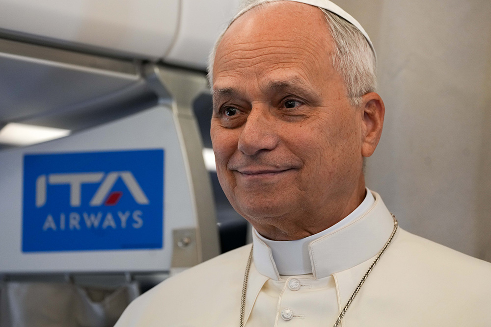 Pope Leo XIV speaks to journalists aboard the papal flight from Rome to Paris Sept. 25, 2026, at the start of his apostolic journey to France and visit to UNESCO. (CNS/Lola Gomez)