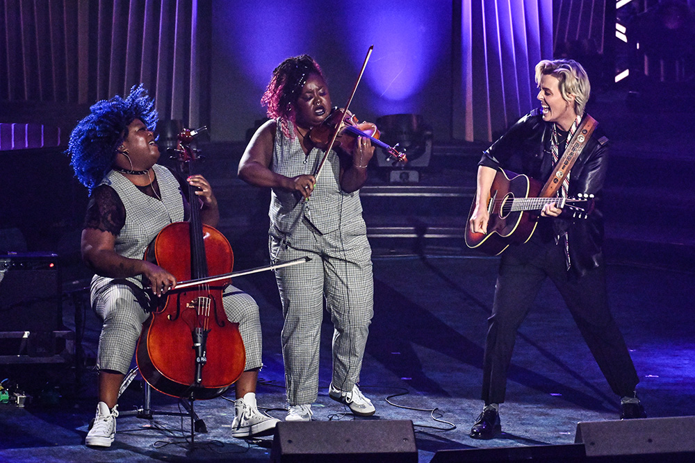 Brandi Carlile (right) performs with Monique Ross (far left) and Chauntee Ross of SistaStrings during the 55th annual Songwriters Hall of Fame Induction and Awards Gala at the Marriott Marquis Hotel on Thursday, June 11, 2026, in New York. (AP/Invision/Evan Agostini)