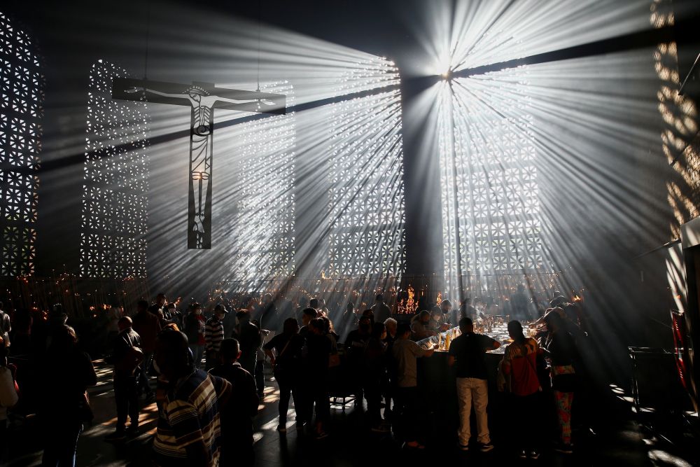 People light candles in celebration of the feast of Our Lady of Aparecida at the Basilica of the National Shrine of Our Lady of Aparecida in São Paulo Oct. 12, 2021. (OSV News/Reuters/Carla Carniel)