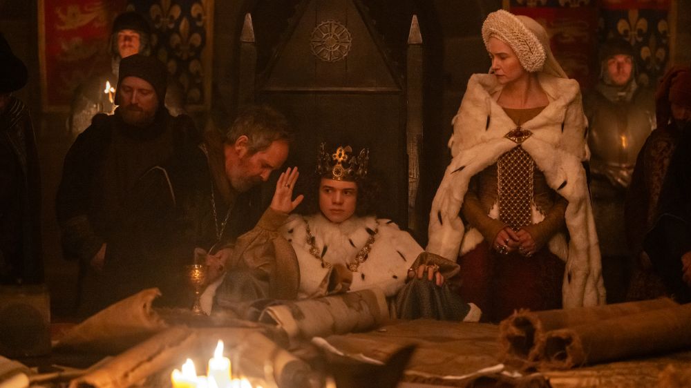 Tom Hollander as Treasurer Hales, Woody Norman as King Richard II and Katherine Waterston as The Countess interact in director Paul Greengrass' "The Uprising," which opens in theaters Sept. 11.(Focus Features/Betina La Plante)