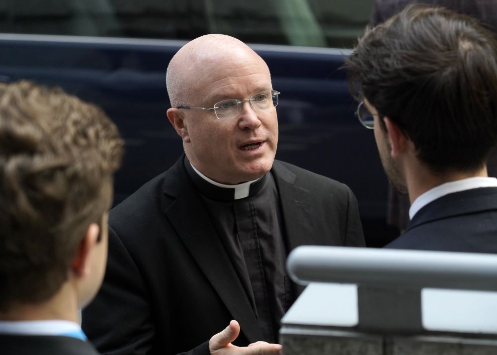 Msgr. Roger Landry, director of the Pontifical Mission Societies USA, speaks with people outside Holy Family Church in New York City Sept. 9, 2024. (OSV News/Gregory A. Shemitz)