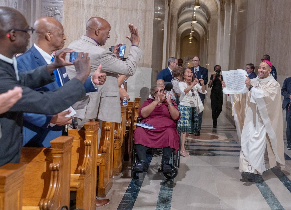 After being handed the apostolic letter from Pope Leo XIV appointing him as a new auxiliary bishop of Washington, Bishop Robert Boxie III displays the document during his ordination Mass July 7, 2026, at the Basilica of the National Shrine of the Immaculate Conception in Washington. (OSV News/Catholic Standard/Mihoko Owada)