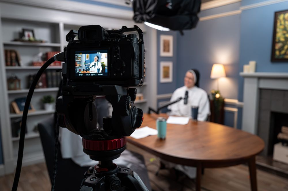 Sr Miriam Holzman, of the Dominican Sisters of Mary, Mother of the Eucharist, sits in the order's Openlight Media studio in Ann Arbor, Michigan, where they produce "Dominican Sisters Open Mic" podcast. (Courtesy of Openlight Media)
