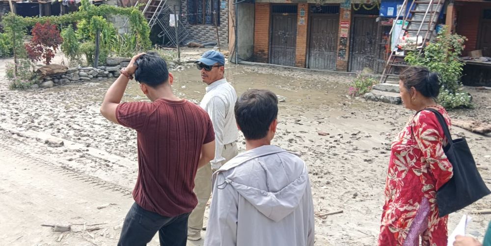 Members of an assessment team by the Sisters of Charity of Nazareth, Kathmandu, and the Nepal Jesuit Social Institute tour flood-affected areas in the Galchi rural municipality of Dhading, a largely agricultural area in northeast Nepal. (Courtesy of Sisters of Charity of Nazareth, Kathmandu)