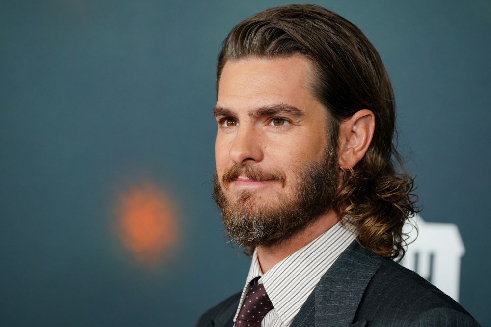 Andrew Garfield, shown arriving at the premiere of "The Uprising" on Sept. 2, 2026, has described feeling a "spiritual urgency" when choosing roles and has a reputation for gravitating toward characters with deep religious conviction. (AP/Invision/Jordan Strauss) 