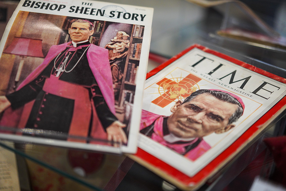 Publications featuring the late Archbishop Fulton Sheen are displayed among other artifacts and memorabilia at the Sheen Museum on July 15, 2026, in Peoria, Ill. (AP/Jessie Wardarski)