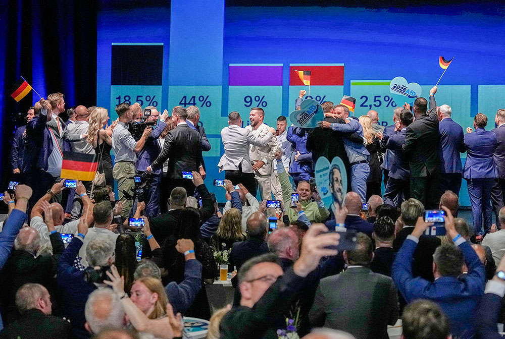 Alternative for Germany party members celebrate after the first results of the Saxony-Anhalt state elections in Magdeburg, eastern Germany, Sept. 6, 2026. (AP/Matthias Schrader)