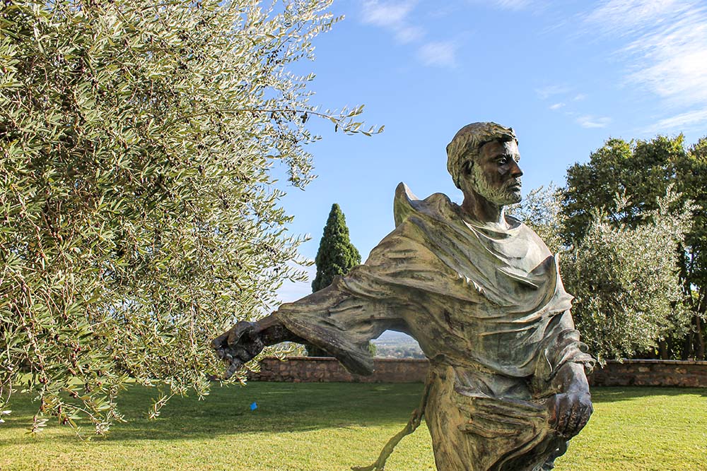 A statue of St. Francis of Assisi stands in the garden outside the Church of San Damiano in Assisi, Italy. (NCR photo/Brian Roewe)