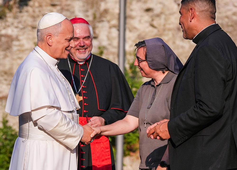 Pope Leo XIV greets Salesian Sr. Alessandra Smerilli, secretary general of the Vatican Dicastery for Promoting Integral Human Development, at Borgo Laudato Si' in Castel Gandolfo, near Rome July 29, 2026. (AP/Alessandra Tarantino)