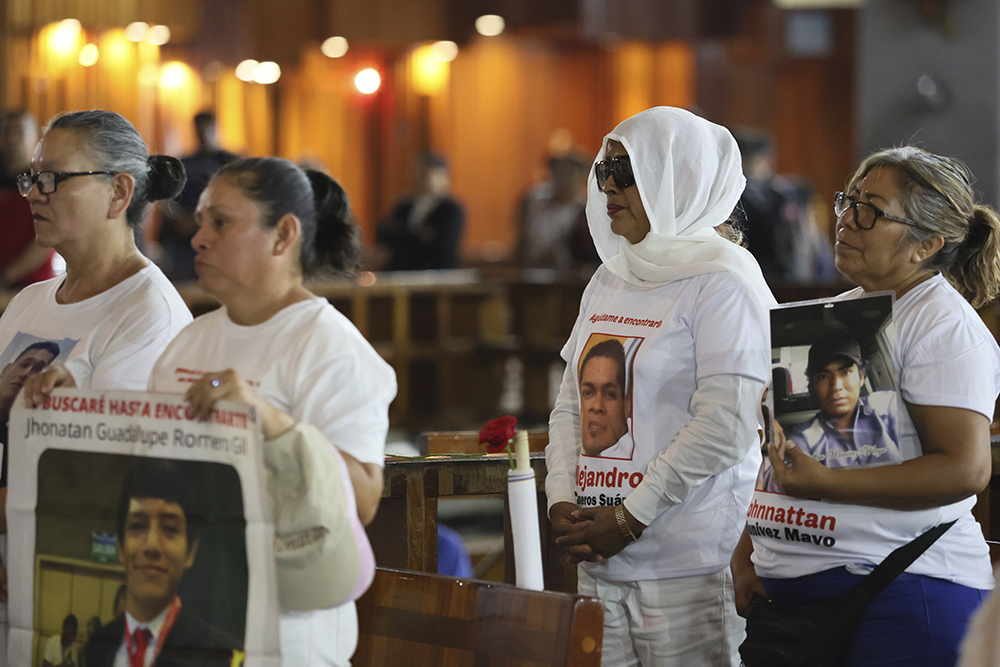 “Madres buscadoras” or searching mothers attend a Mass at the Basilica of Guadalupe in Mexico City, on Mother's Day, May 10, 2024. The searching mothers' volunteers look for the bodies of missing people, conducting their own hunts for clandestine graves where cartels hide their victims. (AP Photo/Ginnette Riquelme)