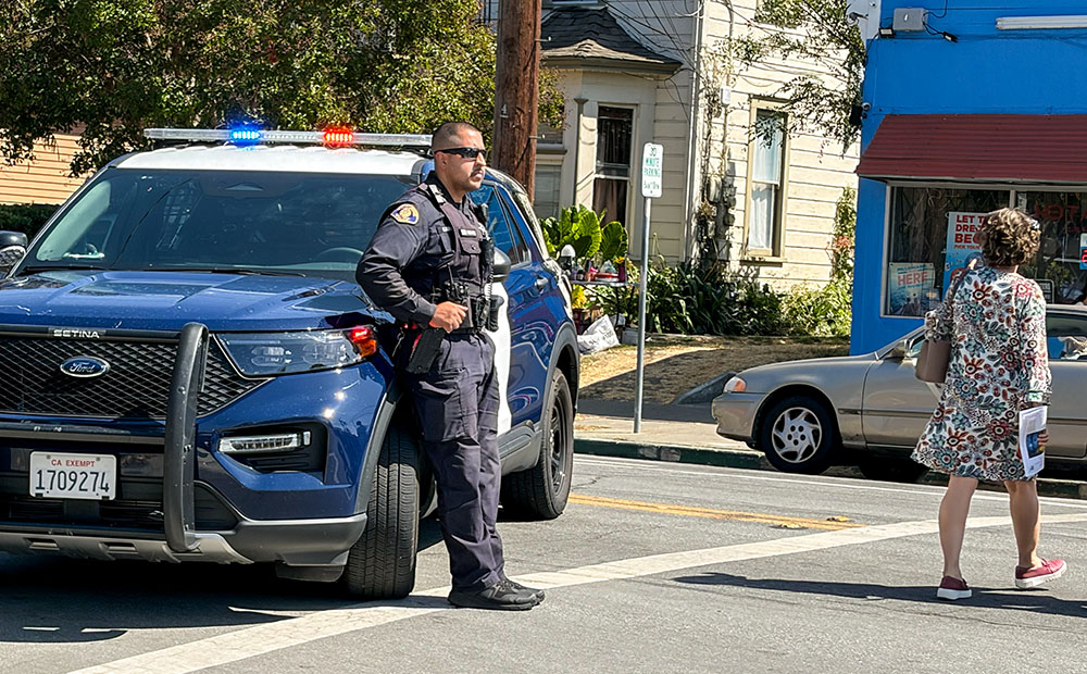 A police officer blocks traffic for a parish-to-parish procession in support of immigrants in San Jose, California, Sept.13, 2026. (Marissa Nichols)