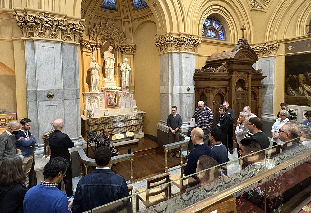 LGBTQ Catholics, clergy, religious, family members and other Catholic pilgrims pray at the altar dedicated to victims of HIV/AIDS at St. Francis Xavier Church in New York City, Sept. 26. (NCR photo/Camillo Barone)