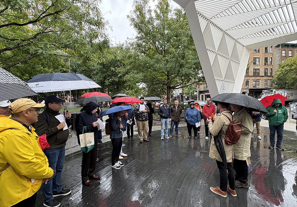 LGBTQ Catholics, clergy, religious, family members and other Catholic pilgrims pray at the New York City AIDS Memorial by the site of St. Vincent's Hospital run by the Sisters of Charity of New York, which was New York's first Catholic hospital and epicenter of HIV/AIDS treatment in the area, Sept. 26. (NCR photo/Camillo Barone)