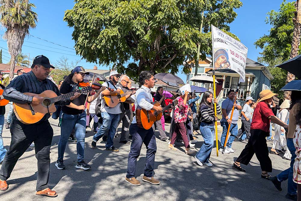 Holy Cross Parish musicians offer hymns to the Virgin Mary in Spanish during a Catholic procession in support of immigrants in San Jose, California, Sept.13, 2026. (Marissa Nichols)
