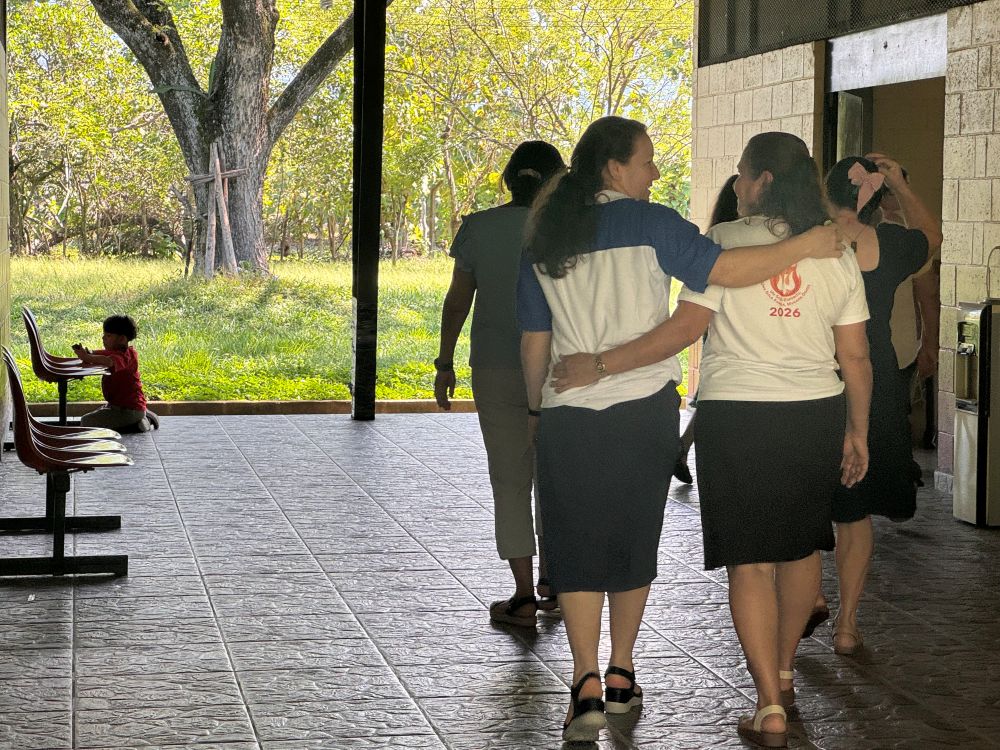 Sr. of the Immaculate Conception Ivania Blandón Montenegro, left, walks with a laywoman at a retreat center in El Paraíso, El Salvador, Sept. 12, 2026, during a gathering of the New Women and Synodality, a group where women religious and laywomen practice synodality to learn what it means. (GSR photo/Rhina Guidos) 