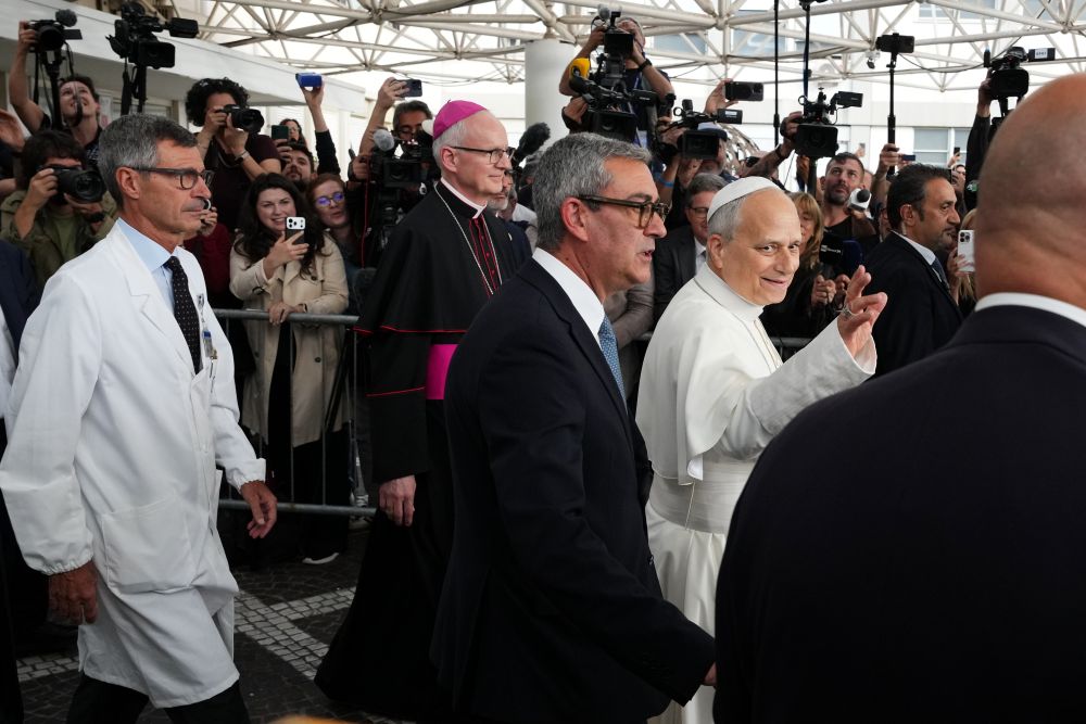 Pope Leo XIV, followed by surgeon Stefano Margaritora, Archbishop Petar Rajič, prefect of the Papal Household, and Commander of the Vatican Gendarmerie Gianluca Gauzzi Broccoletti, leaves Rome's Agostino Gemelli Polyclinic on Oct. 17, 2026, after surgery Oct. 13 to remove lung cancer. (AP/Alessandra Tarantino)