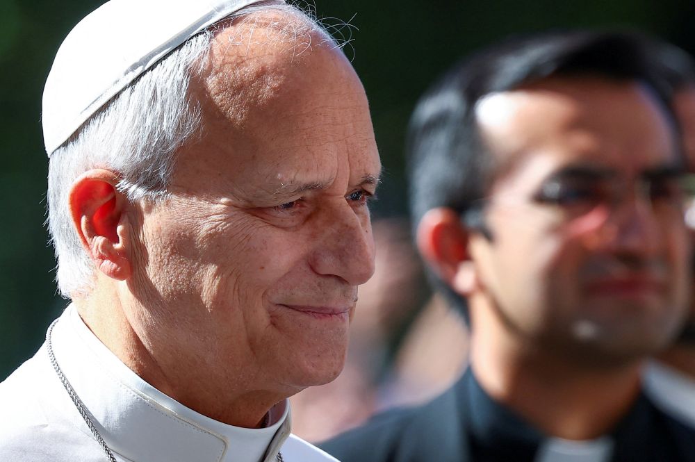 Pope Leo XIV smiles as he arrives at Rome's Gemelli Hospital Oct. 13, 2026, ahead of his surgery that afternoon to remove a lung nodule. (OSV News/Reuters/Guglielmo Mangiapane)