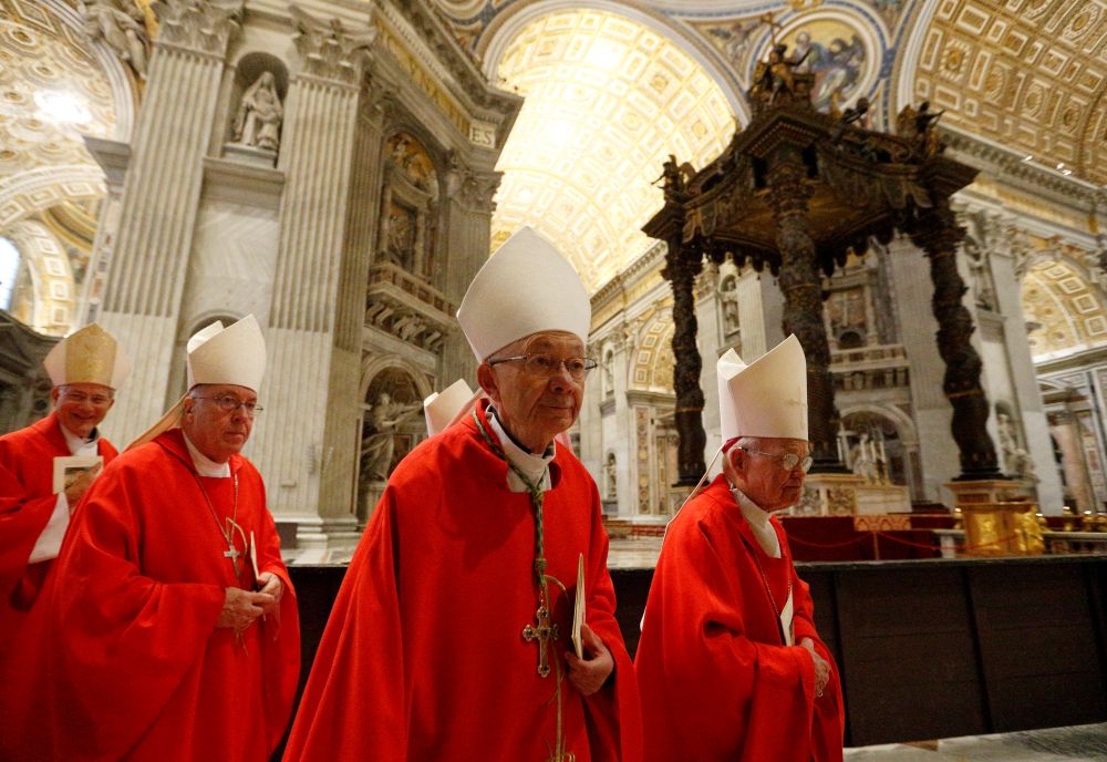 Bishop J. Douglas Deshotel of Lafayette, La., center, and other U.S. bishops arrive to concelebrate Mass in the crypt of St. Peter's Basilica at the Vatican Dec. 5, 2019. (CNS/Paul Haring)