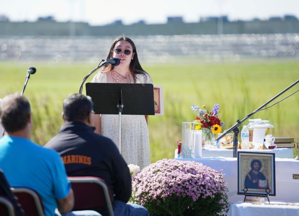 Lindsay Reyes, a 25-year-old U.S. citizen and lifelong resident of Indiana, speaks at the Sept. 27 Mass at Miami Correctional. Reyes' husband, a legal permanent resident for more than 30 years, has been in ICE detention for seven months. (Courtesy of Allison Mayer)