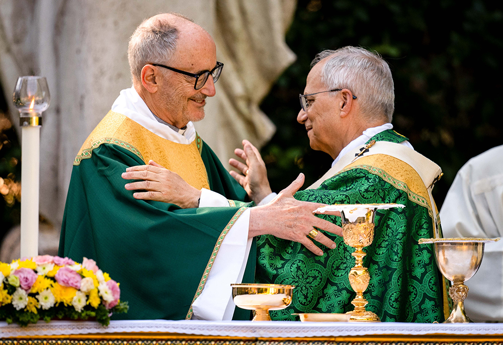 Pope Leo XIV exchanges a sign of peace with Cardinal Michael Czerny, prefect of the Dicastery for Promoting Integral Human Development, while celebrating Mass for the Care of Creation on the grounds of the Borgo Laudato Si' ecology center in Castel Gandolfo, Italy, July 9, 2025. (CNS/Cristian Gennari, pool)