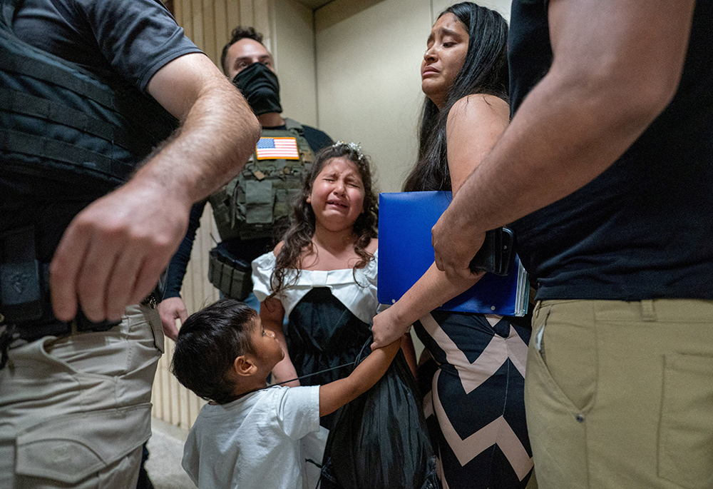 A child weeps as her father is detained by federal immigration officers at U.S. immigration court in the Manhattan borough of New York City July 25, 2025. (OSV News/Reuters/David 'Dee' Delgado)