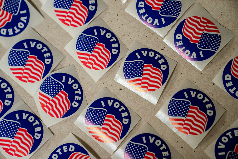 Stickers are lined up on a table for voters at the American Legion Post 53 polling location in Eau Claire, Wis., April 1, 2025. (OSV News/Reuters/Erica Dischino)