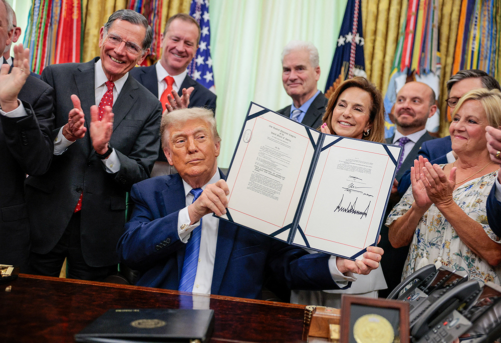 U.S. President Donald Trump signs the Secure America Act, which provides another $70 billion for immigration enforcement, in the Oval Office at the White House in Washington June 10, 2026. (OSV News/Reuters/Evan Vucci)