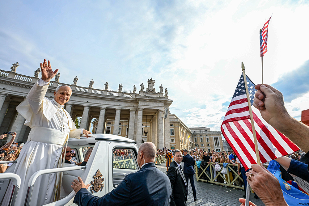 U.S. flags are seen among the crowd as Pope Leo XIV greets visitors and pilgrims from the popemobile while riding around St. Peter’s Square at the Vatican before his weekly general audience Oct. 7, 2026. (CNS/Vatican Media)