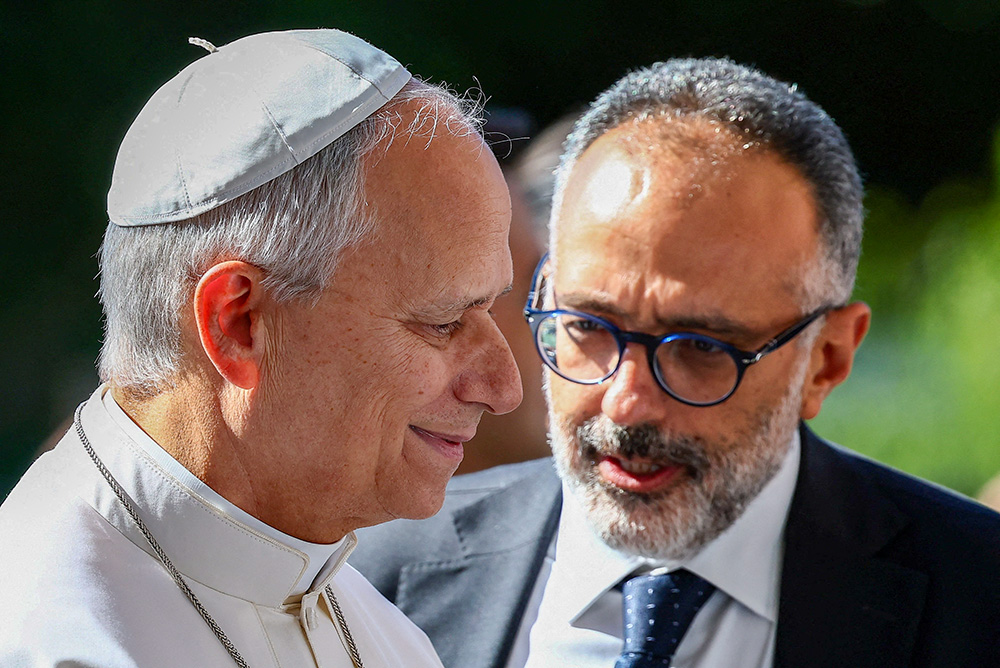 Pope Leo XIV talks with his personal physician, Luigi Carbone, as the pontiff arrives at Rome's Gemelli Hospital Oct. 13, 2026, ahead of his surgery that afternoon. (OSV News/Reuters/Guglielmo Mangiapane)