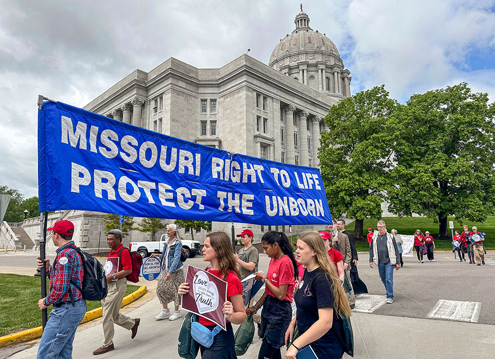 Participants in the Midwest March for Life walk past the Missouri Capitol in Jefferson City on May 1, 2025. (AP/David A. Lieb)