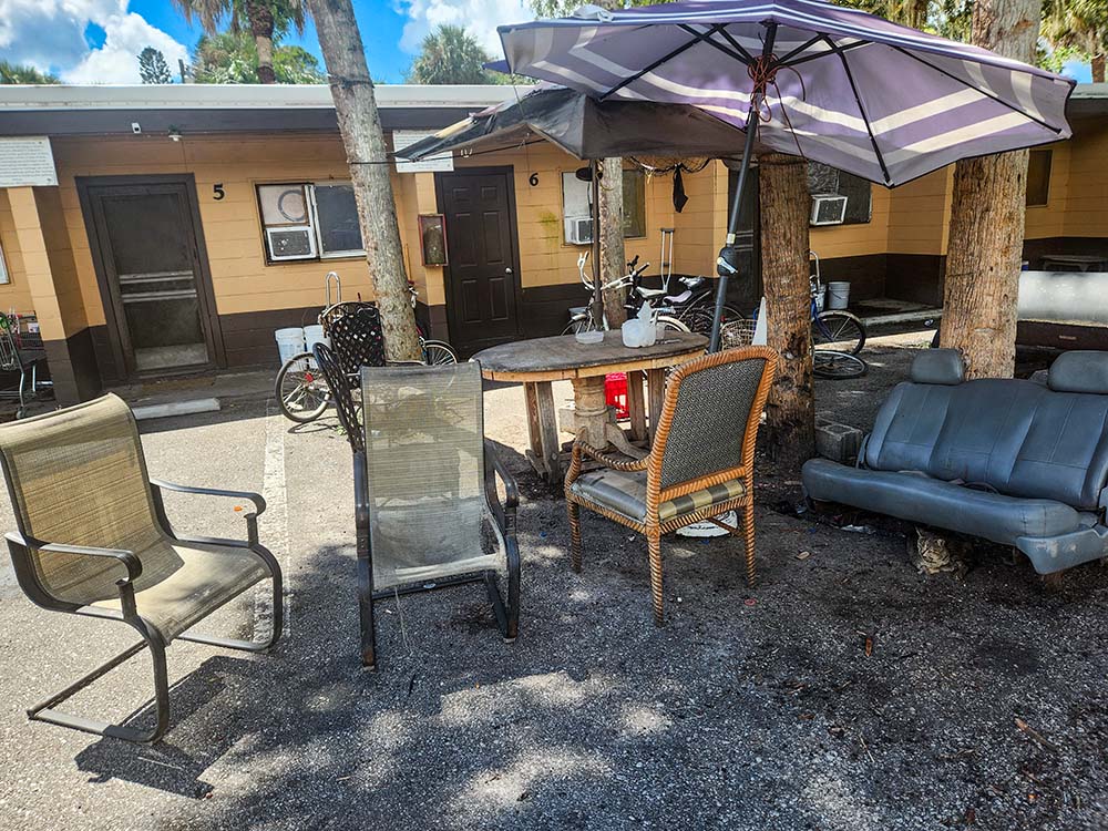 Men would once play dominoes outside in midday in Immokalee but not now given fears of raids by agents of ICE. (GSR photo/Chris Herlinger)