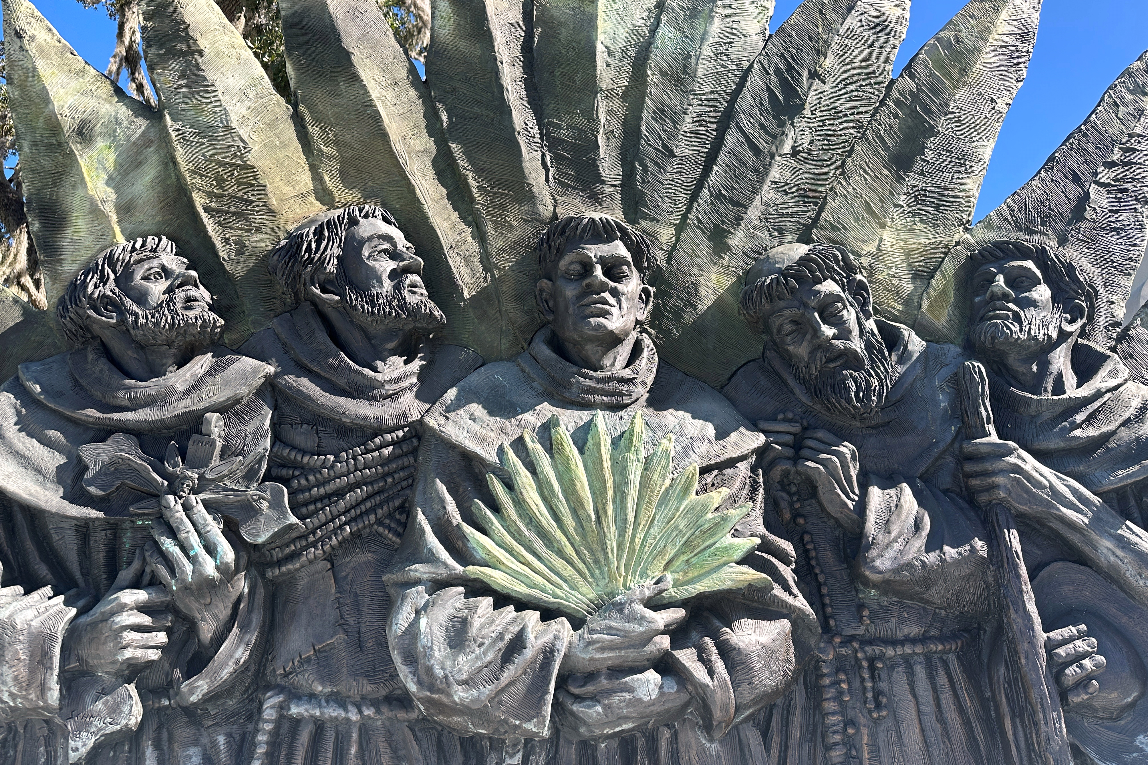 a sculpture, depicting five Spanish missionaries who were killed in 1597, stands outside the Nativity of Our Lady Catholic Church in Darien, Georgia