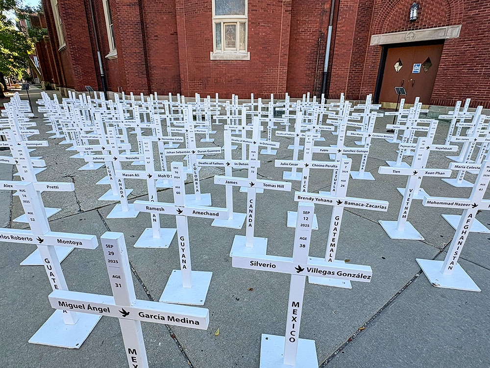 The traveling installation of the immigrant crosses is displayed outside the Mother of the Americas Parish in Chicago's Little Village neighborhood, Oct. 3, 2026. (NCR photo/Camillo Barone)