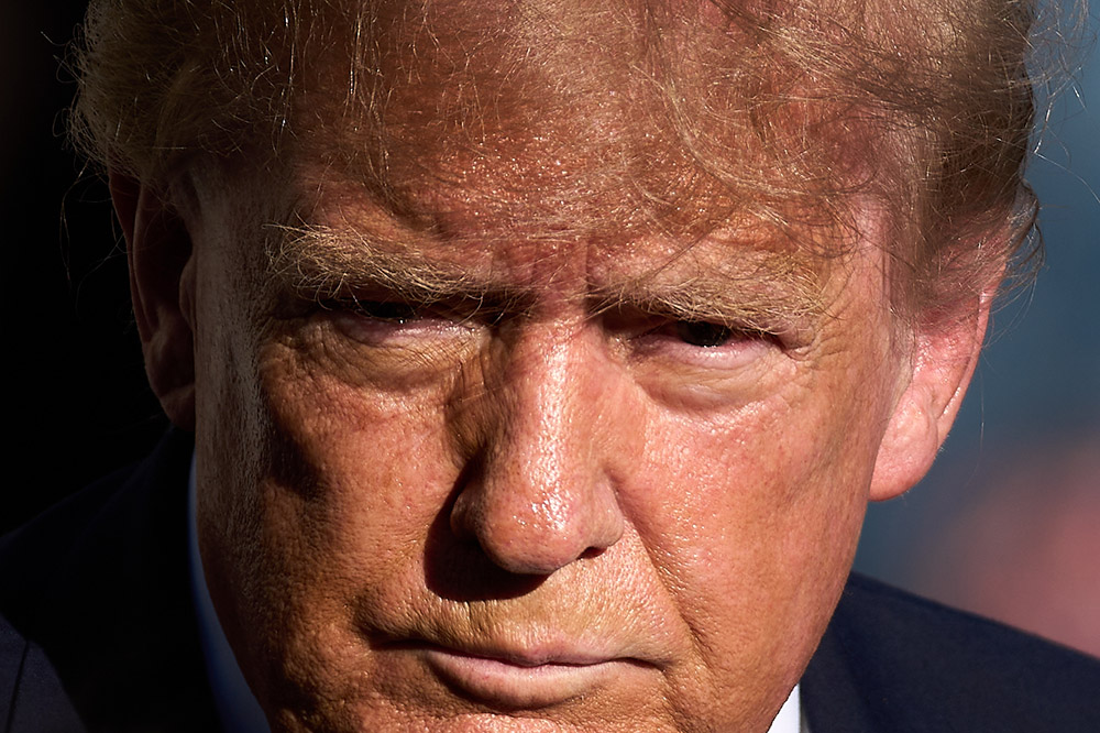 President Donald Trump speaks to reporters before boarding Marine One on the South Lawn of the White House, Thursday, Oct. 22, 2026, in Washington. (AP/Julia Demaree Nikhinson)