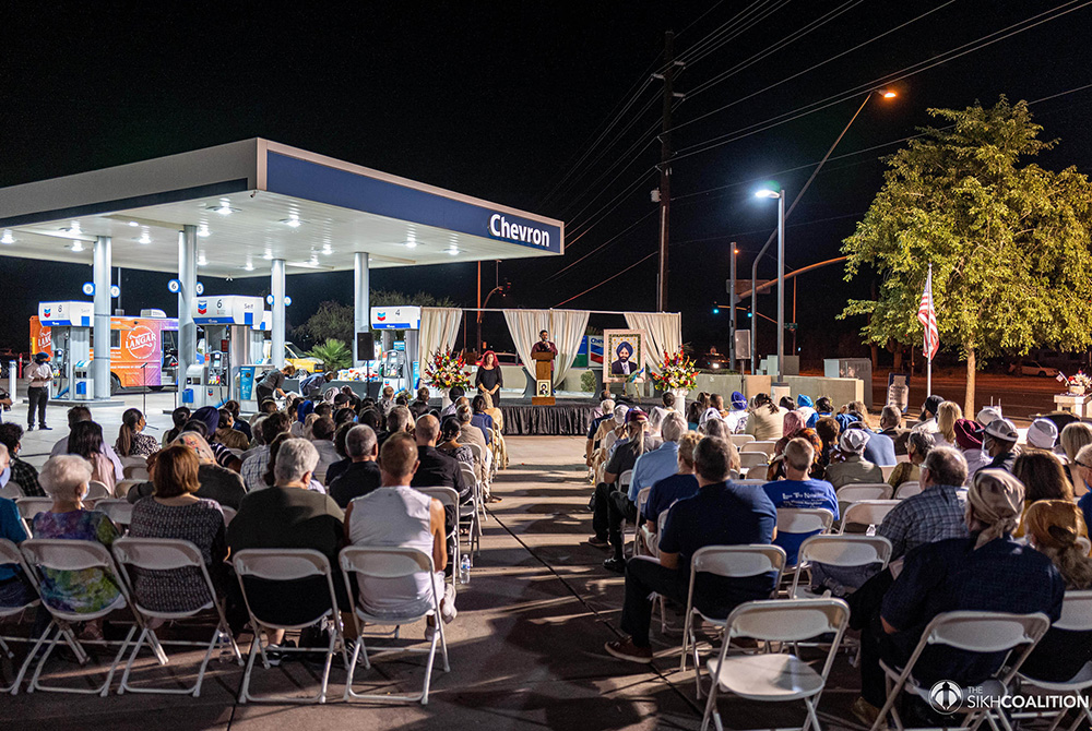 People attend the 20th anniversary memorial for Balbir Singh Sodhi at Sodhi's Chevron gas station Sept. 15 in Mesa, Arizona. (Photo by Lee Media, courtesy of the Sikh Coalition)