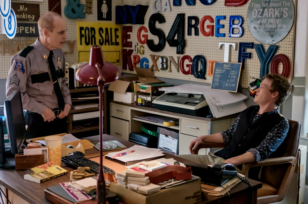 Blink and you miss it: Flannery O'Connor's short story collection "A Good Man Is Hard to Find" can be spotted on the desk of Red Welby (Caleb Landry Jones) as he talks to desk sergeant Cedric (Zeljko Ivanek) in "Three Billboards Outside Ebbing, Missouri." Blink and you miss it: Flannery O'Connor's short story collection "A Good Man Is Hard to Find" can be spotted on the desk of Red Welby (Caleb Landry Jones) as he talks to desk sergeant Cedric (Zeljko Ivanek) in "Three Billboards Outside Ebbing, Missouri."