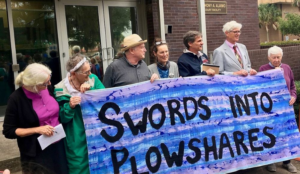 Patrick O'Neill, second from right, stands outside the U.S. District Courthouse in Brunswick, Georgia, on Oct. 24, 2019, just after the trial on charges related to a 2018 protest against nuclear weapons. 