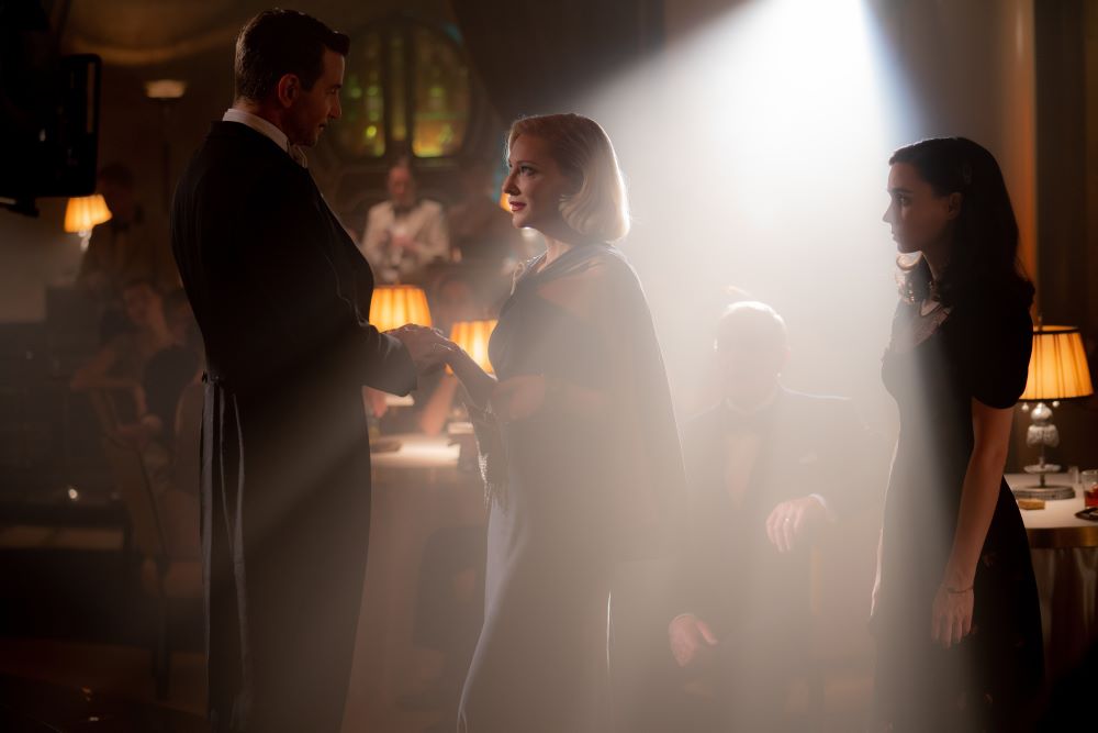 Bradley Cooper (Stanton Carlisle), Cate Blanchett (Lilith Ritter) and Rooney Mara (Molly) star in a scene from the movie "Nightmare Alley." The Oscar-nominated movie is in theaters and streaming on Hulu and HBOMax. (CNS/20th Century Studios/Kerry Hayes)